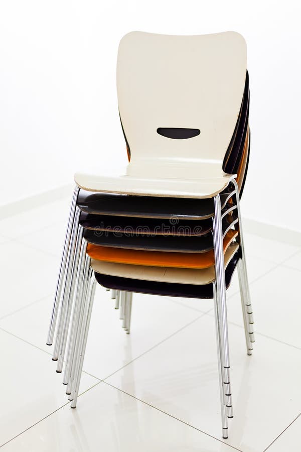 Stacked plastic chairs stock image. Image of chair, orange 72797601