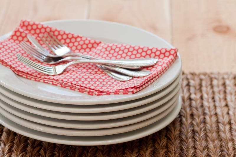 Stacked plates with forks stock image. Image of brown 20675491