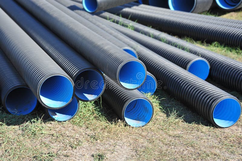 Stacked PVC pipe stock photo. Image of construction, drainage 61784314