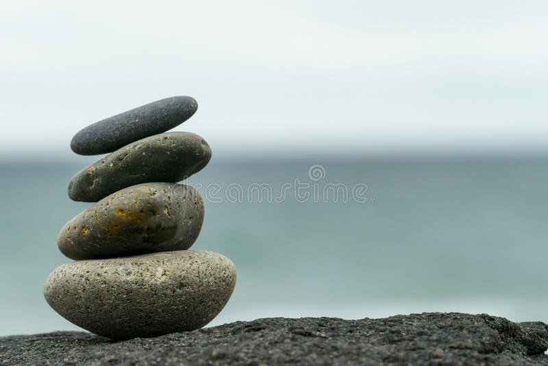 Stacked rocks inuksuk at the beach