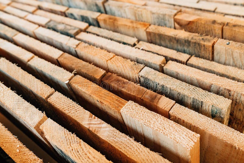 Stacked rustic wooden boards as construction material royalty free stock photo