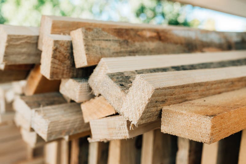 Stacked rustic wooden boards as construction material stock images