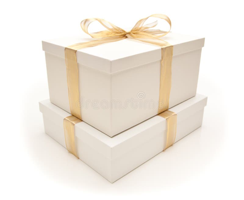 Stacked White Gift Boxes with Gold Ribbon Isolated