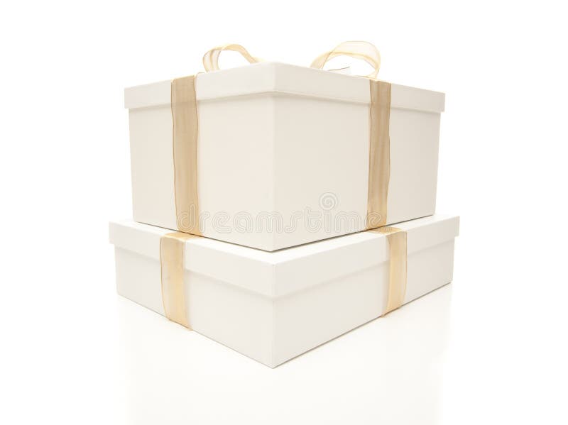 Stacked White Gift Boxes with Gold Ribbon Isolated