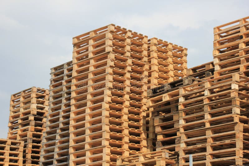Stacked wooden pallets stock photo. Image of transport - 53918868