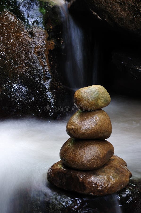 Stacked of zen stones and waterfall