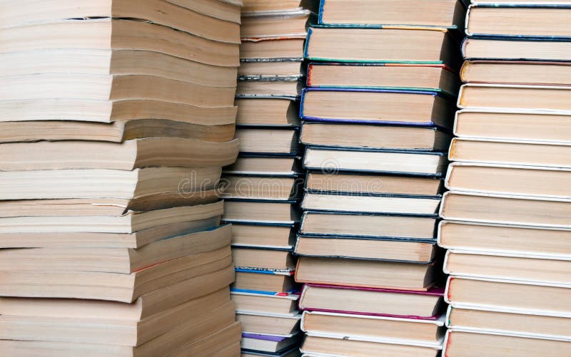 people running with huge stacks of books people running with huge stacks of books