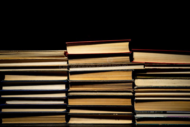 Stacks of Books in Red, Blue, Green Covers on Black Isolated Background ...
