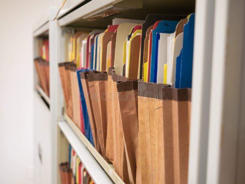 Stacks of Document Paper and Files Folder in a Filing Stock