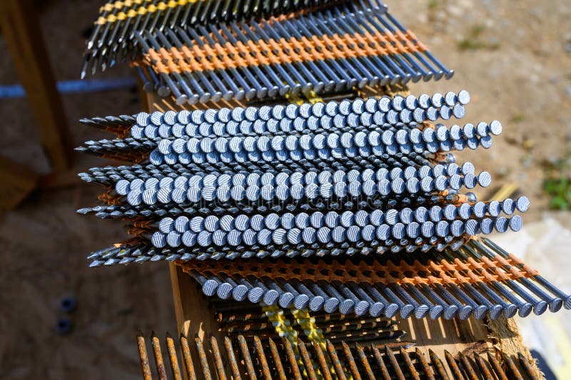 Stacks of Framing Nails Sitting on the Windowsill of a House Under Construction in a New
