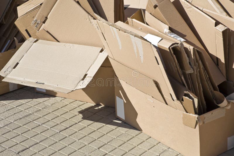Stacks of paper and cardboard ready to be recycled - Reuse, Reduce, Recycle concept image.