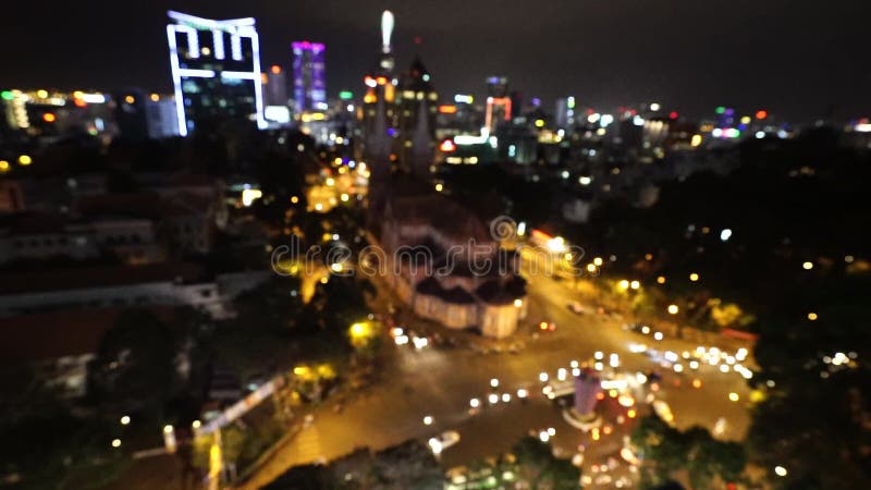 Stad bij nachtachtergrond met auto's Uit nadruk unfocused de achtergrond met onscherp stadslichten Ho Chi Minh, Vietnam