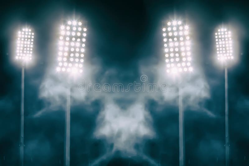 Stadium lights and smoke against dark night sky
