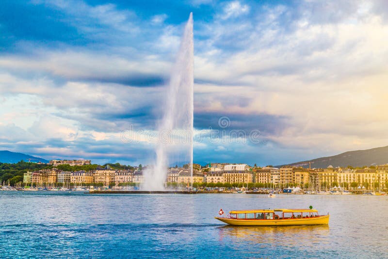Beautiful view of Geneva skyline with famous Jet d'Eau fountain at harbor district in beautiful evening light, Switzerland. Beautiful view of Geneva skyline with famous Jet d'Eau fountain at harbor district in beautiful evening light, Switzerland.