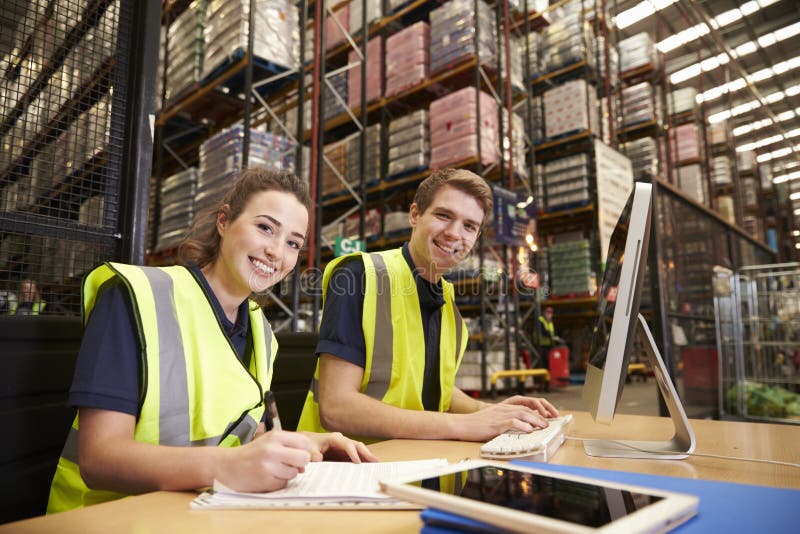 Staff in the Office of a Distribution Warehouse, To Camera Stock Photo Image of desktop, copy