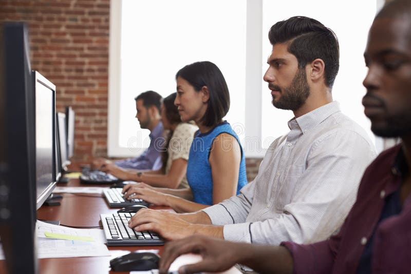 Staff Working in Busy Customer Service Department Shot Stock Photo