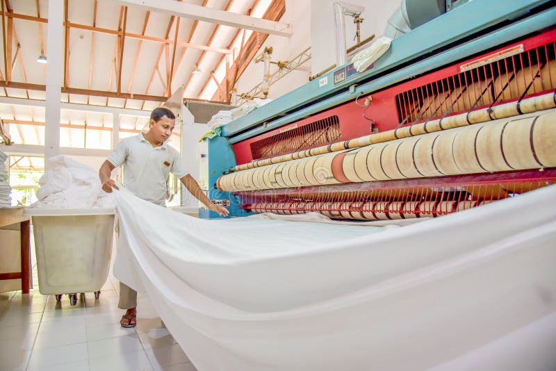 Staff in Uniform Ironing Bed Sheet Using Special Machine Editorial Photography Image of