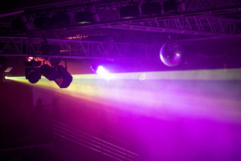 Stage Lights. Concert Light. Silver Mirror Disco Ball in the Rays of