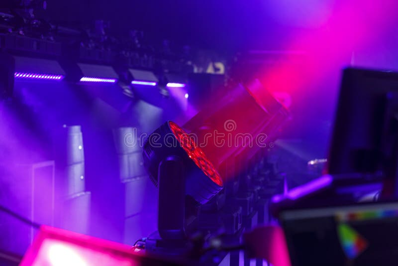 Stage Spotlights Rotating Heads in Neon Lighting. Stock Image Image
