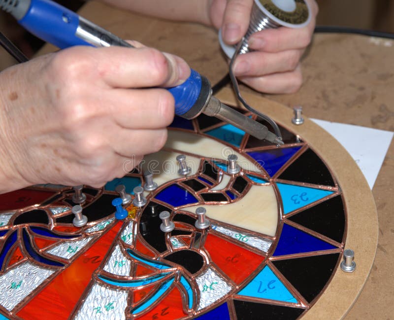 Stain Glass Artist Uses a Soldering Tool. Stock Image Image of glass