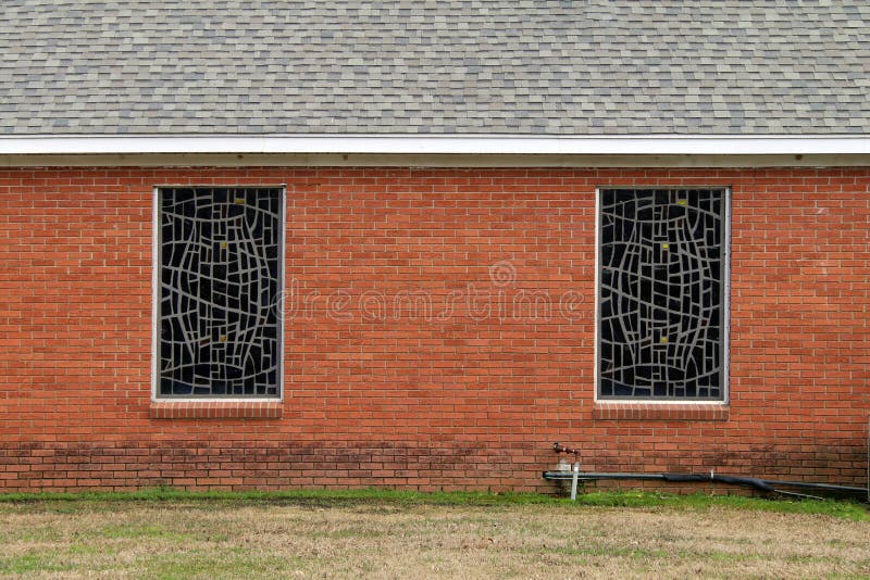 Stained glass church windows red brick wall