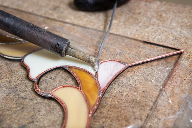Soldering of stained glass stock image. Image of tiffany 29812665