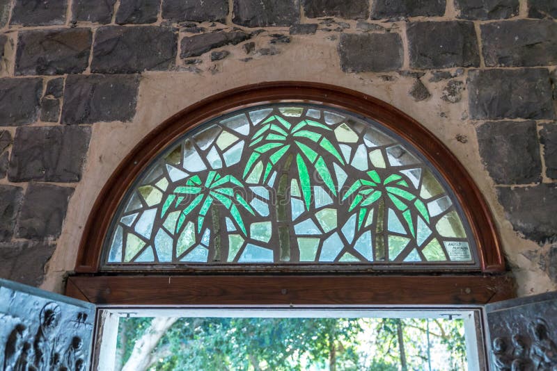 Stained glass window above the front door to the Church of the Primacy of Saint Peter located on the shores of the Sea of Galilee royalty free stock image Stained glass window above the front door to the Church of the Primacy of Saint Peter located on the shores of the Sea of Galilee royalty free stock image