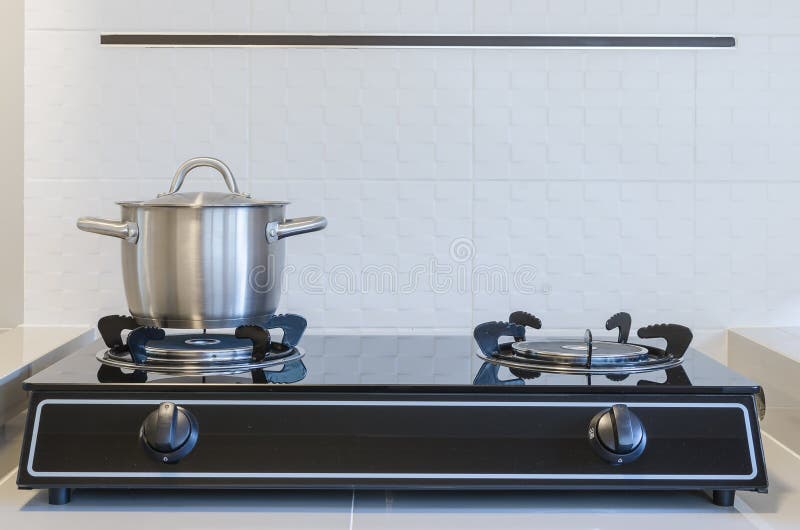 Stainless pot on gas stove stock photo. Image of iron 48328010