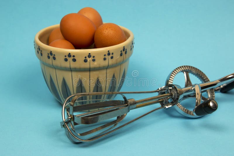 Pair of manual hand egg beater mixer Stock Photo - Alamy