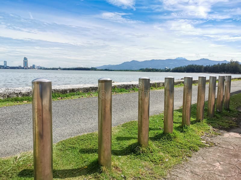 Stainless steel poles to restrict traffic in pedestrian areas by the road side.