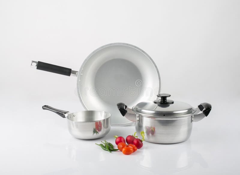 Stainless Steel Pots and Pan with Vegetables Isolated on White Stock