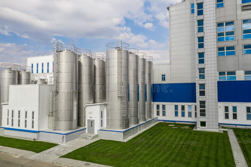 Stainless steel tanks at a food processing plant side view stock photo