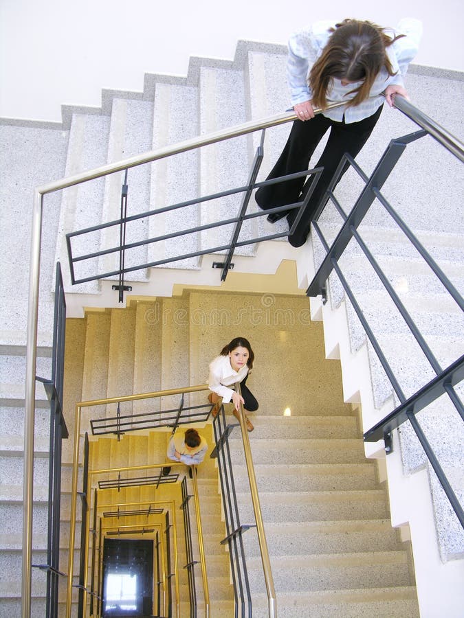 Staircase 2. Business people on a staircase looking up or down. Can work great for many business shots focusing casual corporate environment or business Staircase 2. Business people on a staircase looking up or down. Can work great for many business shots focusing casual corporate environment or business