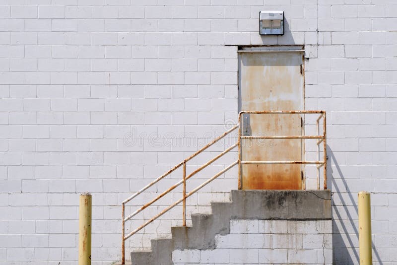 Stairway to rusty door royalty free stock photos