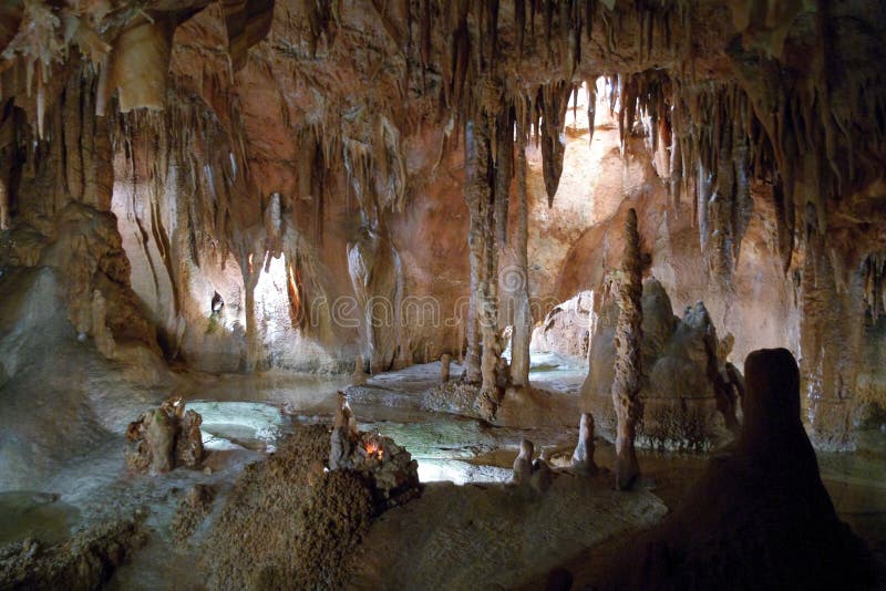 A natural cave with stalactites and stalagmites. A natural cave with stalactites and stalagmites