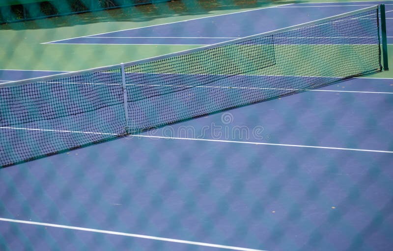 Steel mesh fence of the tennis courts background. Steel mesh fence of the tennis courts background