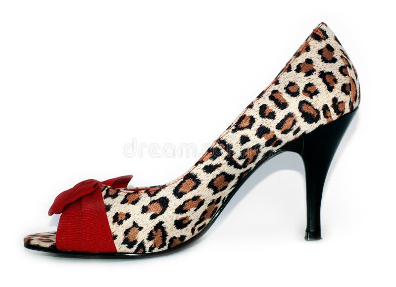 Stampa sexy del leopardo delle signore e pattini rossi dell'alto tallone fotografia stock libera da diritti Stampa sexy del leopardo delle signore e pattini rossi dell'alto tallone fotografia stock libera da diritti