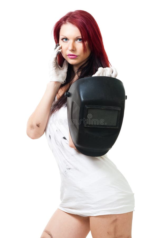 Stand de femme et masque de soudure de prise images stock Stand de femme et masque de soudure de prise images stock
