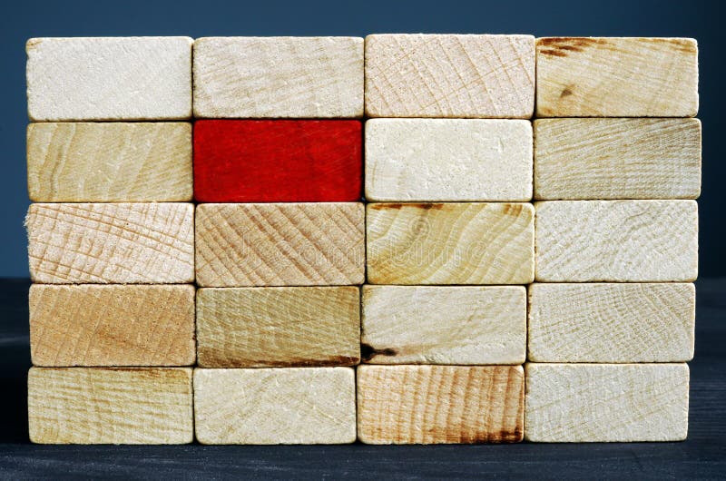 Stand out from the crowd concept. Red wooden block and whites royalty free stock photos Stand out from the crowd concept. Red wooden block and whites royalty free stock photos