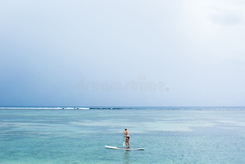 Stand Up Paddle Board Couple Paddleboarding Mauritius Island. Stock