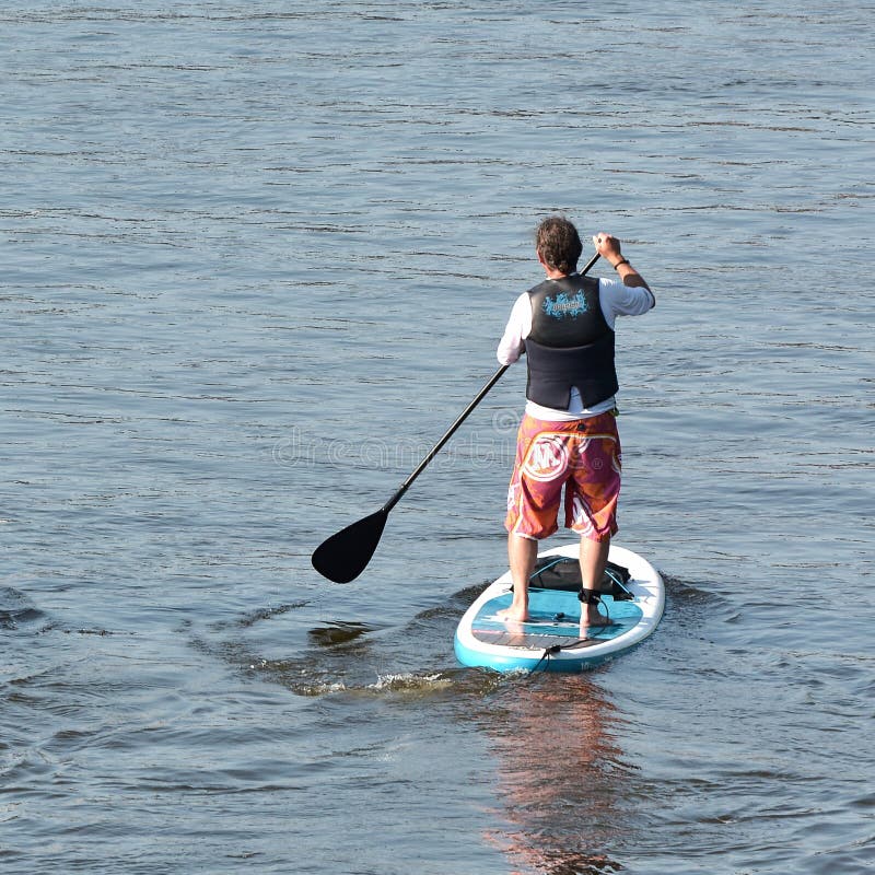 Stand Up Paddling editorial photography. Image of surfboard 58912607