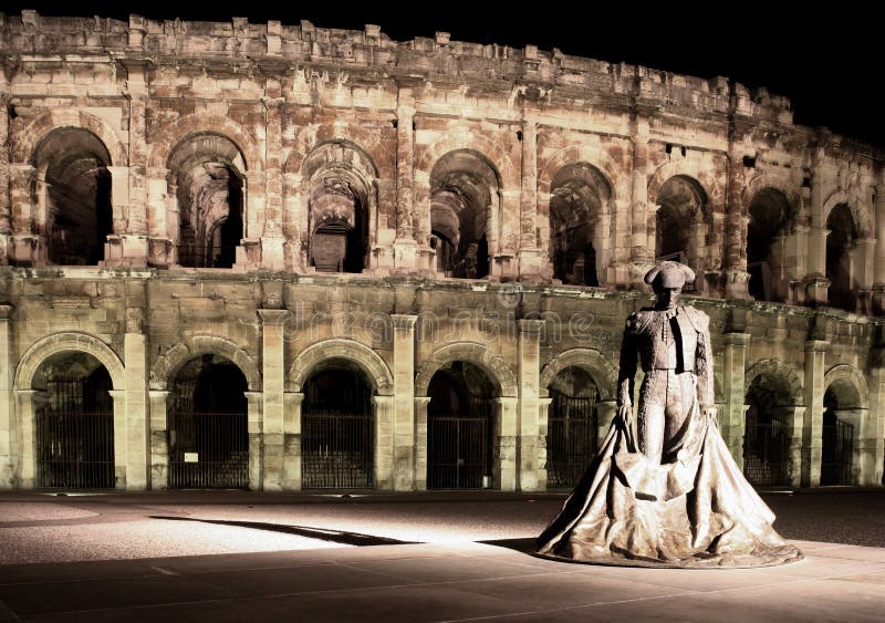 Statue of famous bullfighter in front of the arena in Nimes, France. (panoramic photo made of multiple shots -> huge resolution,. Statue of famous bullfighter in front of the arena in Nimes, France. (panoramic photo made of multiple shots -> huge resolution,