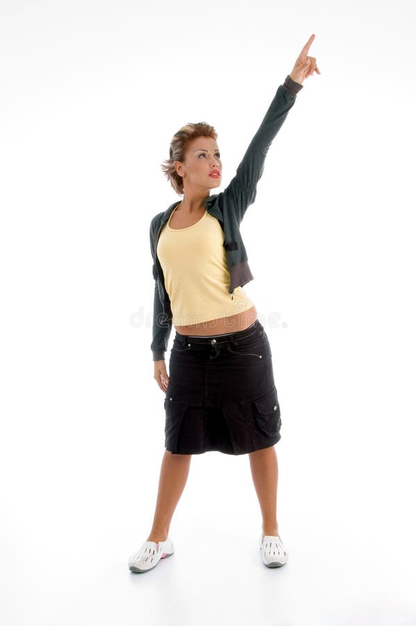 Standing attractive woman pointing upward