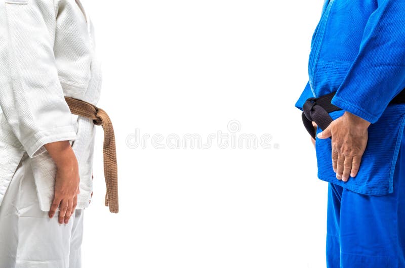 Standing bow of female judo brown belt to her sensei black belt