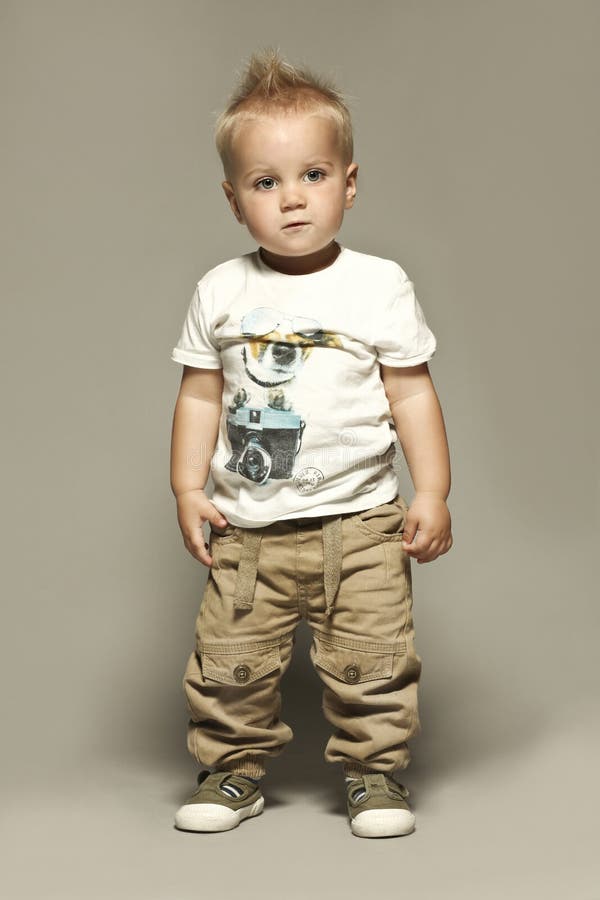 Standing caucasian blond boy child portrait