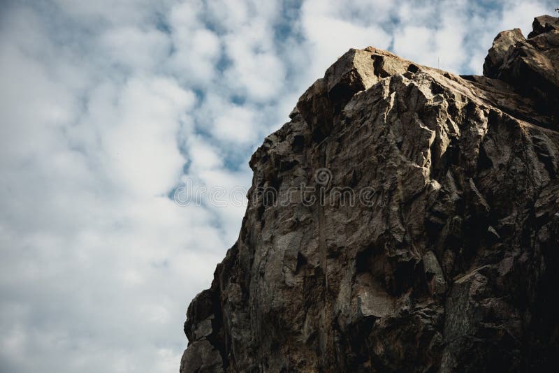 Standing empty on top of a mountain view, cliff edge with mountain on clouds blue sky royalty free stock photography