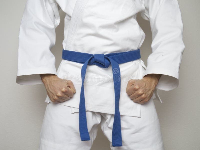 Standing fighter blue belt centered martial arts