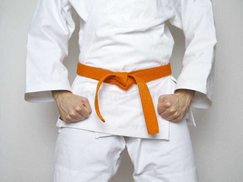 Standing fighter orange belt centered martial arts