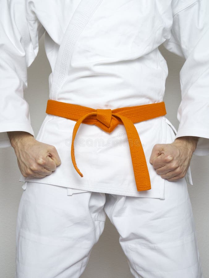 Standing fighter orange belt martial arts white suit