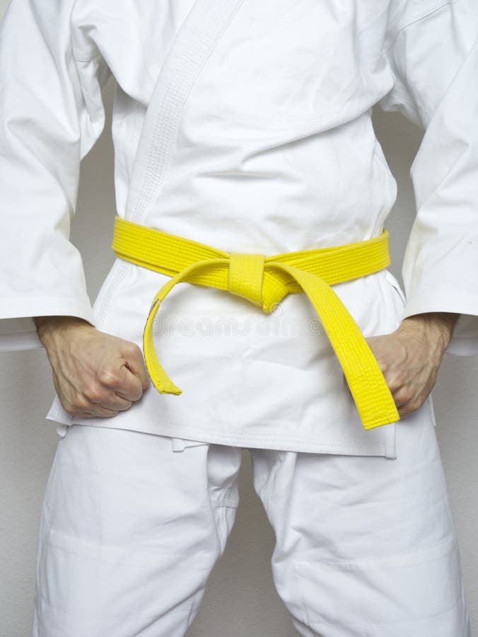 Standing fighter yellow belt martial arts white suit